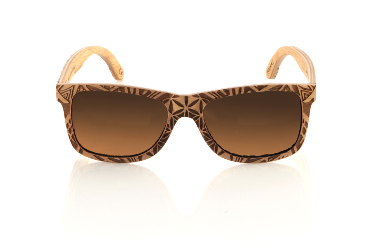 Wood eyewear of Beech MAURITANIA. The MAURITANIA wooden sunglasses have a shape inspired by the classics, made of beech wood. These glasses are distinguished by their exclusive finish engraved with an ethnic pattern, reflecting the arid tones of desert landscapes in every detail. Beech wood, in addition to its durability, provides a texture and color that makes each pair a unique piece. Designed for those looking for an accessory that stands out, the MAURITANIA are perfect for adding a touch of originality to your style. Measurement: 145x45. Caliber: 54. With them, you will take a piece of nature and adventure wherever you go. for Wholesale & Retail | Root Sunglasses® 